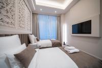Damas Suites Budapestにあるベッド