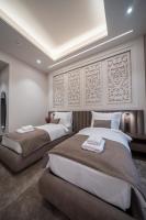 Damas Suites Budapestにあるベッド