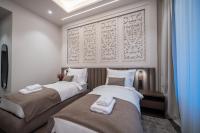 Damas Suites Budapestにあるベッド