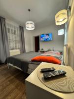 Posteľ alebo postele v izbe v ubytovaní Apartament Marcel