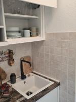 Kuchyň nebo kuchyňský kout v ubytování Apartments iris