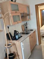 Kuchyň nebo kuchyňský kout v ubytování Apartments iris