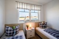 Postel nebo postele na pokoji v ubytování Ferienhaus Strand Hus by Seeblick Ferien ORO, Bestlage am Strand,Sauna,Kamin