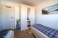 Postel nebo postele na pokoji v ubytování Ferienhaus Strand Hus by Seeblick Ferien ORO, Bestlage am Strand,Sauna,Kamin