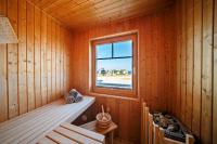 Postel nebo postele na pokoji v ubytování Ferienhaus Strand Hus by Seeblick Ferien ORO, Bestlage am Strand,Sauna,Kamin