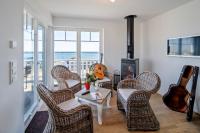 Posezení v ubytování Ferienhaus Strand Hus by Seeblick Ferien ORO, Bestlage am Strand,Sauna,Kamin