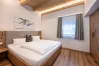 Łóżko lub łóżka w pokoju w obiekcie AUSTRIA APPART - natural Lifestyle Appartements auf der Piste