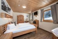 Łóżko lub łóżka w pokoju w obiekcie AUSTRIA APPART - natural Lifestyle Appartements auf der Piste