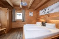 Łóżko lub łóżka w pokoju w obiekcie AUSTRIA APPART - natural Lifestyle Appartements auf der Piste
