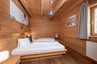 Łóżko lub łóżka w pokoju w obiekcie AUSTRIA APPART - natural Lifestyle Appartements auf der Piste