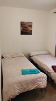 Postel nebo postele na pokoji v ubytování Apartamento Pepe