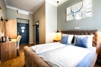 Łóżko lub łóżka w pokoju w obiekcie Vayalen Boutique Hotel