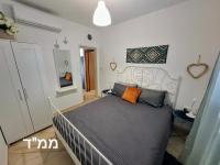 Ein Bett oder Betten in einem Zimmer der Unterkunft shohamseaview