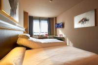 A bed or beds in a room at Silken Monumental Naranco