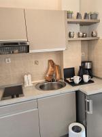 Kuchyň nebo kuchyňský kout v ubytování Apartments iris