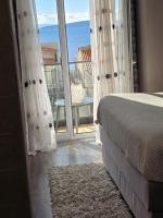 Postel nebo postele na pokoji v ubytování Apartments iris