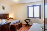 A bed or beds in a room at Villa Bel Giardino