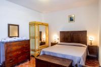 A bed or beds in a room at Villa Bel Giardino