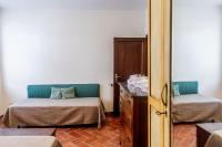 A bed or beds in a room at Villa Bel Giardino