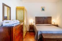 A bed or beds in a room at Villa Bel Giardino