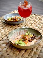 a table with two plates of food and a drink at Izotal Bioluxury Hotel in Taminango