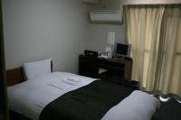 HOTEL CITY INN WAKAYAMA 和歌山駅前にあるベッド