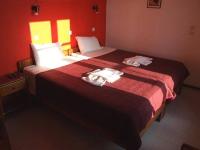 A bed or beds in a room at Islands Apartments