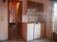 A kitchen or kitchenette at Islands Apartments