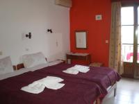 A bed or beds in a room at Islands Apartments