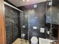 Kúpeľňa v ubytovaní Apartament 38 i 37 Okrzei 1c