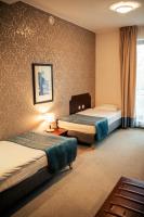 Posteľ alebo postele v izbe v ubytovaní Hotel Kuracyjny Spa & Wellness