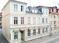 a large white building on the side of a street at Pensionat Svea in Östersund