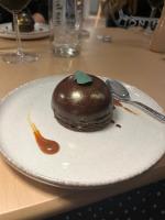 a chocolate dessert on a plate on a table at Boutique Guest House Yes For You in Plovdiv