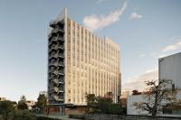 a tall building in the middle of a city at Four Points Flex by Sheraton Utsunomiya in Utsunomiya