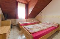 Postel nebo postele na pokoji v ubytování Família Panzió