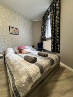 Posteľ alebo postele v izbe v ubytovaní Apartamenty Cieplicka 20a