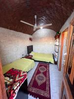 Postel nebo postele na pokoji v ubytování Hashem Nubian Guest House