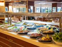 a buffet line with bowls of food on a table at Alder Resort Hotel in Kemer