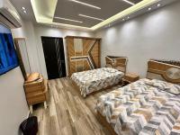 Postel nebo postele na pokoji v ubytování Grand Oasis Rooms