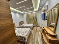 TV a/nebo společenská místnost v ubytování Grand Oasis Rooms