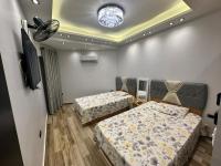 Postel nebo postele na pokoji v ubytování Grand Oasis Rooms