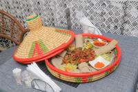 a tray of food sitting on top of a table at Fuego Hotel in Kampala