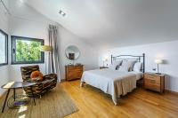 Postel nebo postele na pokoji v ubytování Villa Holivista