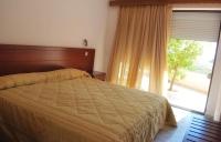 Postel nebo postele na pokoji v ubytování Blue Bay Hotel