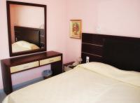 Postel nebo postele na pokoji v ubytování Blue Bay Hotel