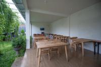 a group of tables and chairs in a room at Kinkeo Borobudur in Magelang