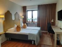Postel nebo postele na pokoji v ubytování Hotel Lysekil