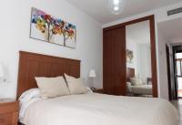 A bed or beds in a room at Apartamento Atenea centro con garaje gratuito