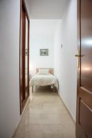 A bed or beds in a room at Apartamento Atenea centro con garaje gratuito