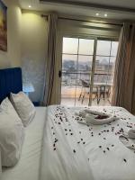 Postel nebo postele na pokoji v ubytování Pyramids Haven Hotel